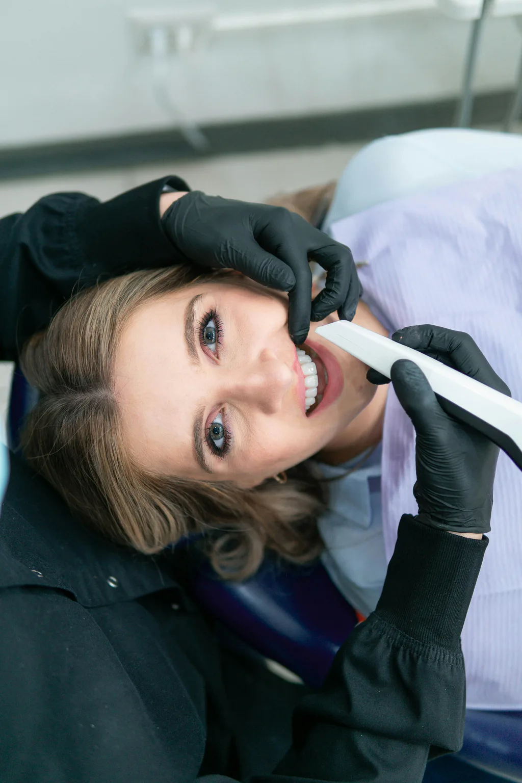A smiling patient relaxed in the dental chair