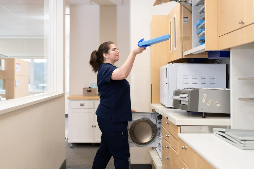 An assistant working in the on-site lab and sterilisation area