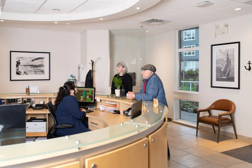 The curved reception desk and waiting area, filled with daylight