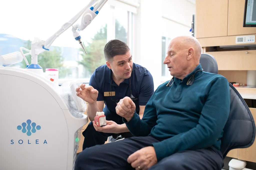 Dr. Séguin talking through a treatment model with a patient