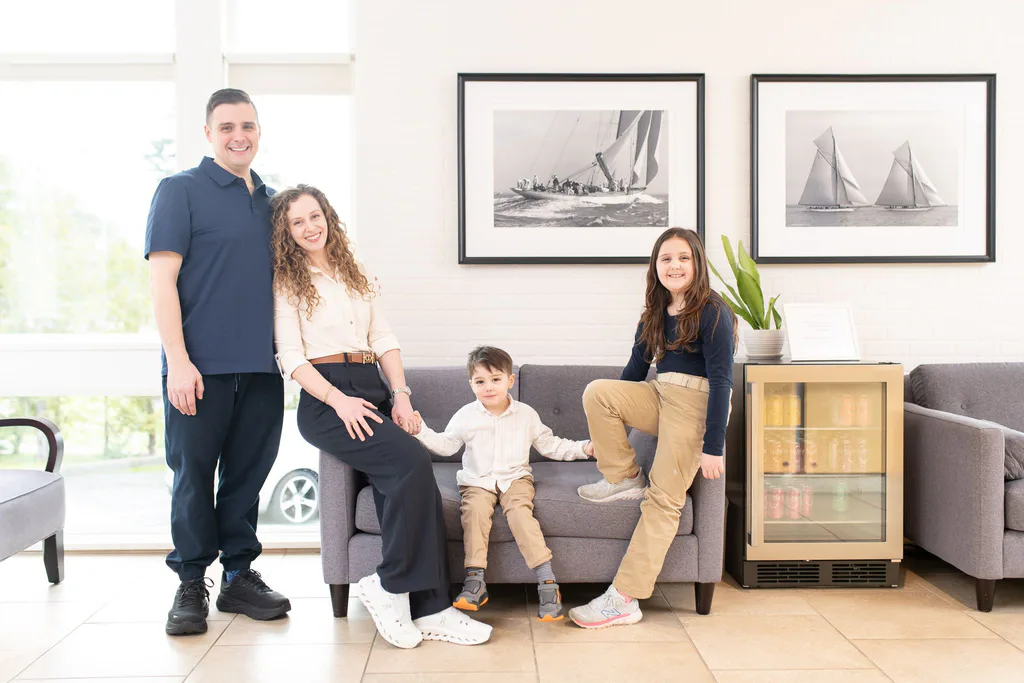 Dr. Séguin and Olivia Séguin with two children in the Seven Sails lounge